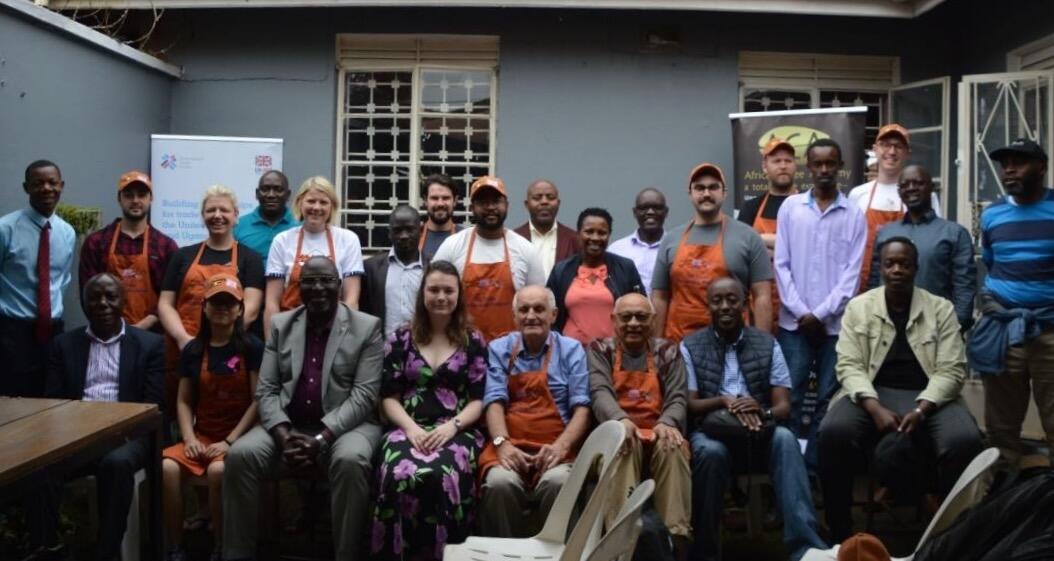 Group of British and Uganda coffee businesses pose for a photo after cupping session