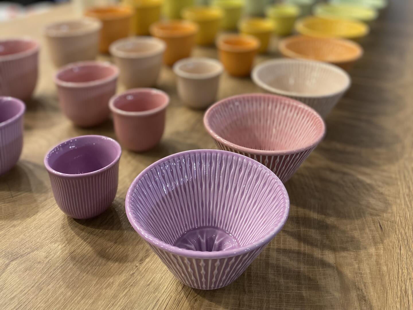 colourful coffee cups in rows