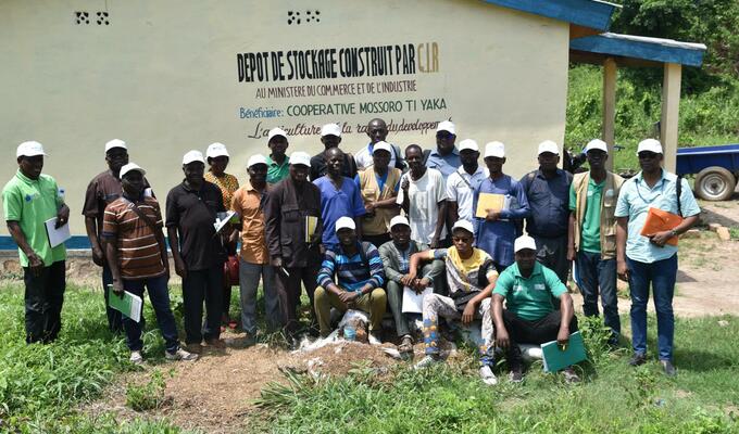 A group of farmers and cooperative trainers on a farm in CAR