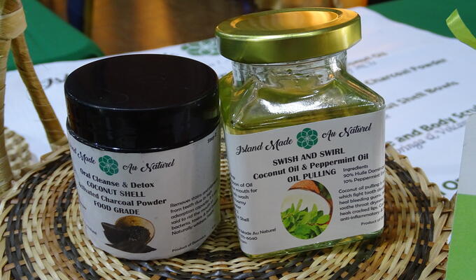Jars of coconut-based dental products