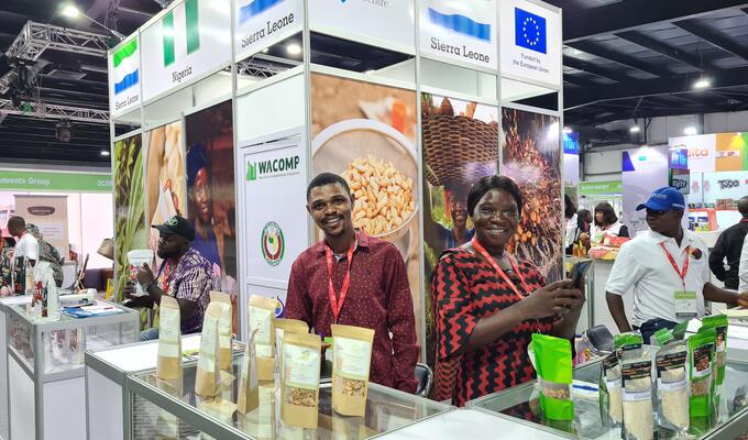 Man from Sierra Leone presents food products at trade fair