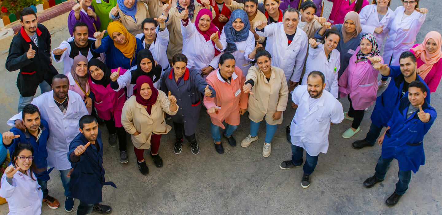 Men and women working for a Tunisian clothing company