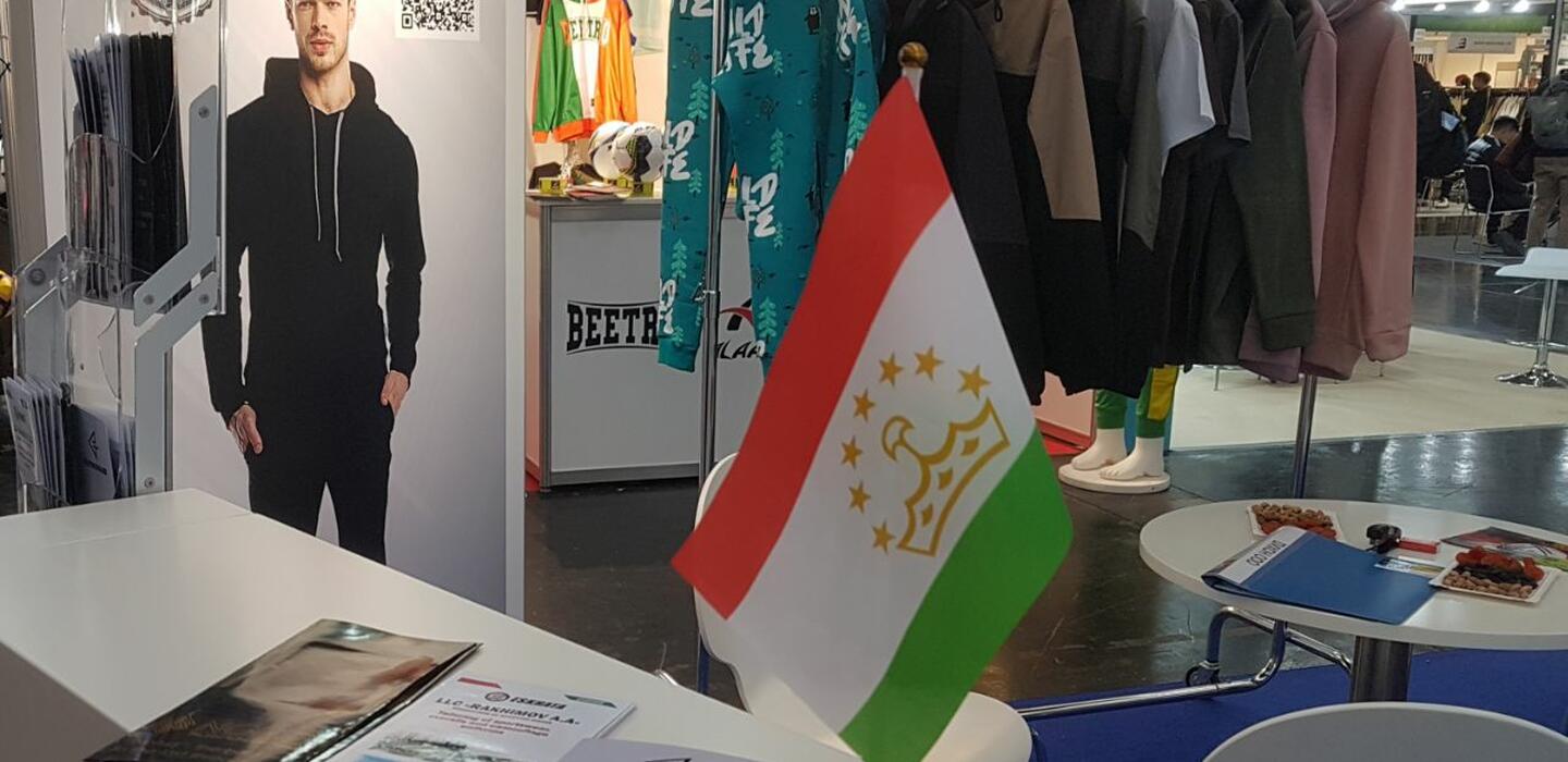 Tajik flag in front of sportswear booth